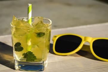 ice cocktail with mint and sunglasses/cold cocktails with ice and mint on outdoor
