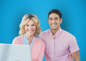 Portrait of happy business people with laptop 