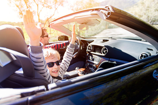 Family In Convertible Car