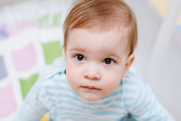 A year-old child is sitting in an arena