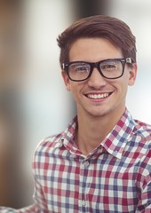 Fototapeta premium Portrait of happy male hipster wearing eyeglasses