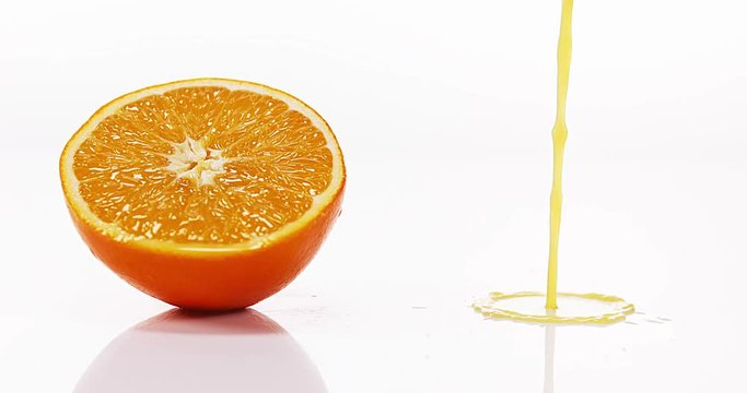Orange, citrus sinensis, Orange Juice Flowing against White background, Slow Motion 4K