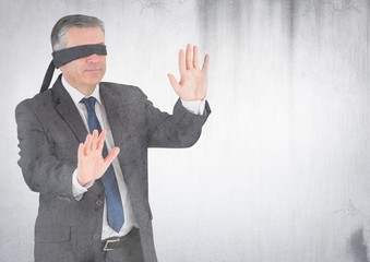 Business man blindfolded with grunge overlay