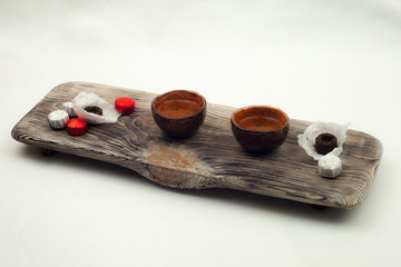 elements of Chinese tea ceremony on a white background, Chinese tea and ceramic cup, wooden plate