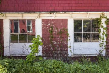 Red exterior building with windows trimmed in white, PEI, Canada