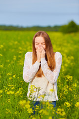 Young delightful female among field