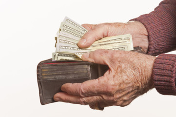 Elderly Man Pulls Money Out Of His Wallet