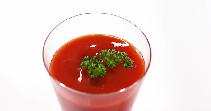 Parsley, Petroselinum crispum, falling into tomatoe's Juice, Slow Motion 4K