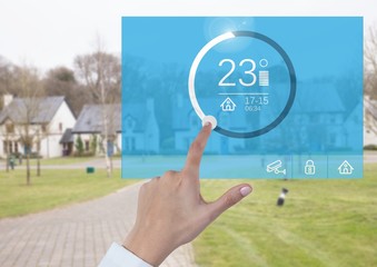 Hand touching a Home automation system App 