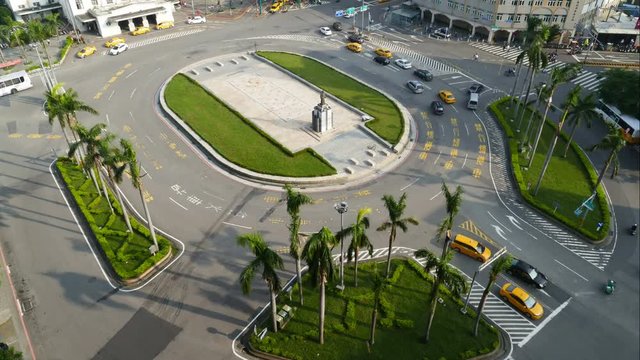 Roundabout with traffic at the train station, time lapse day to night