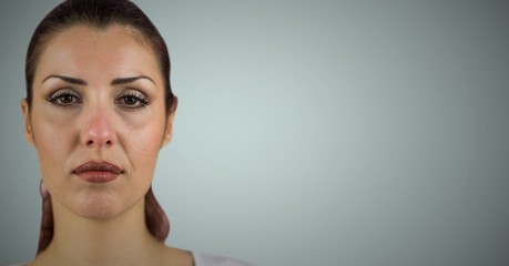 Woman's face after crying against light background