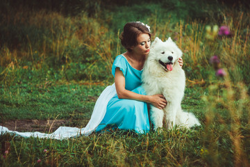 Girl in nature with a dog