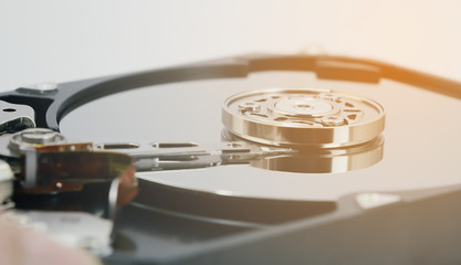 Open cover harddisk and harddisk back - harddisk drive is the data storage for the digital data where is in the your computer isolate on white