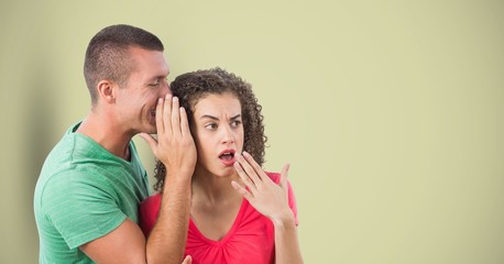 Man whispering in woman's ear 