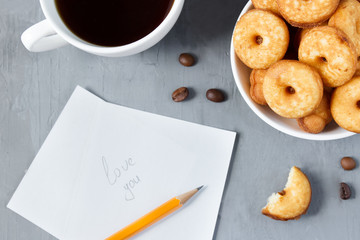Biscuit cookies on the plate.Coffee beans. Selective focus.Pencil inscription 