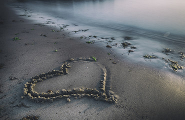 Heart on the beach, romantic concept
