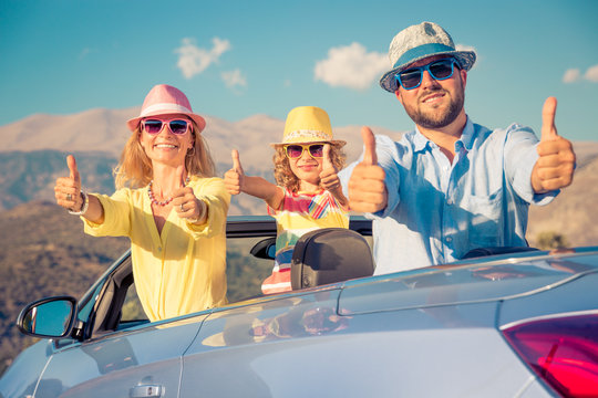 Happy family travel by car in the mountains