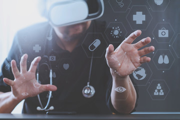 smart doctor wearing virtual reality goggles in modern office with mobile phone using with VR headset with screen icon diagram