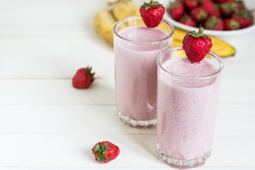 Strawberry banana smoothie healthy breakfast drink in glass