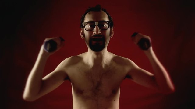 A funny ugly slim nerd man, exercising his arms with some weights, but collapsing under the effort. Dark lighting.
