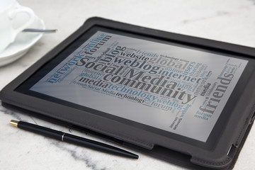 tablet with social media word cloud
