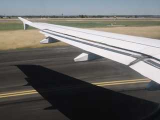 Airplane Wing During Takeoff From  Airport