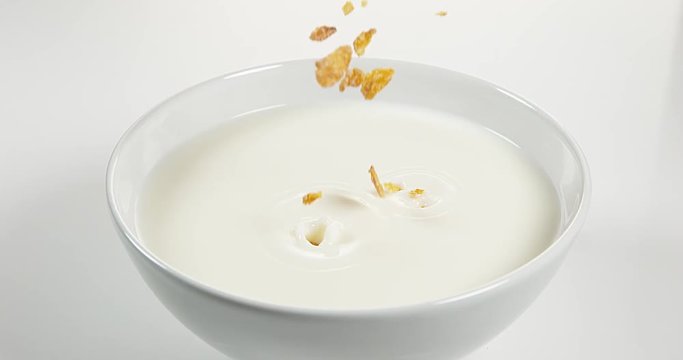 Cereals falling into a Milk Bowl, Slow Motion 4K