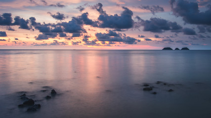 Long exposure of ocean. Sunset warm colors.