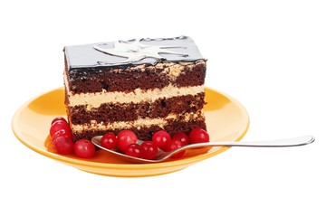 Chocolate cake with cranberries on orange plate