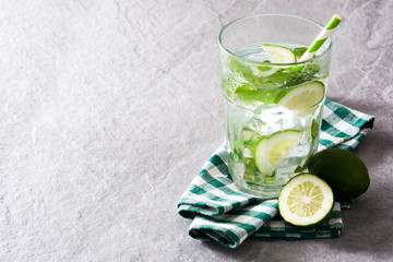 Mojito cocktail in glass on gray stone
