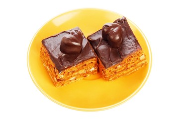 Two chocolate cakes on orange plate