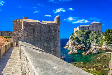 Fototapeta na wymiar Dubrovnik sunny scenery. / View at famous touristic attraction in Dubrovnik town, Croatia.