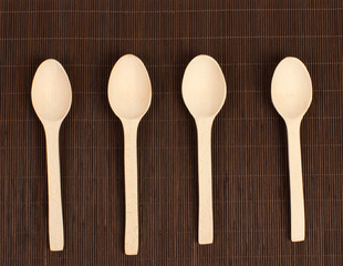 Four wooden spoons on the table