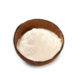 Pile of wheat flour in coconut shell isolated on white
