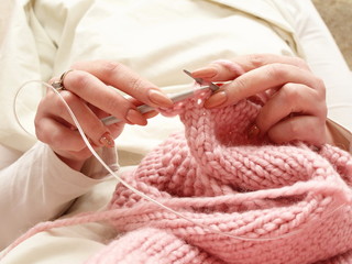 knitting. close up of woman hands knitting with knitting needles.