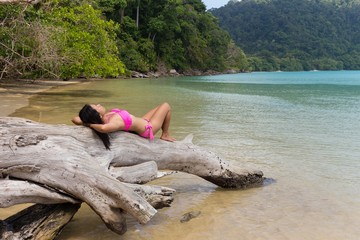 Woman relaxing on tropical beach