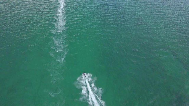 Cool Aerial shot of two jet skis riding on the ocean