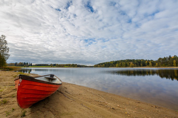 Red boat on the lake shore, Finland