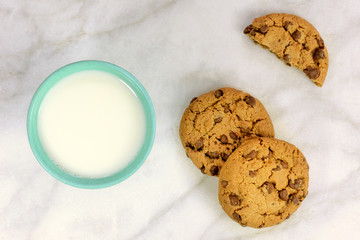 Chocolate chips cookies with glass of milk and copyspace
