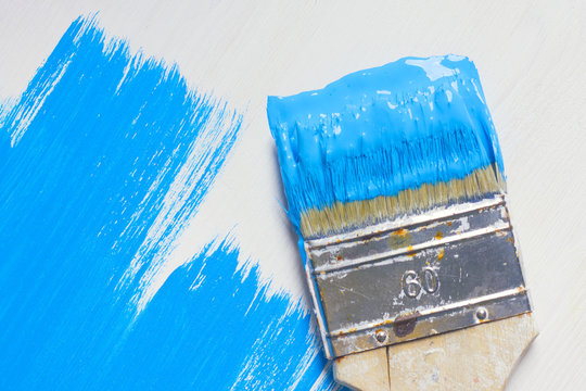 Brush with blue paint