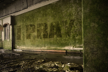 Fototapeta na wymiar text i pray on the dirty wall in an abandoned ruined house