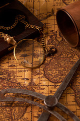 Obraz na płótnie Canvas Old vintage retro compass on ancient world map. Vintage still life. Travel geography navigation concept background.