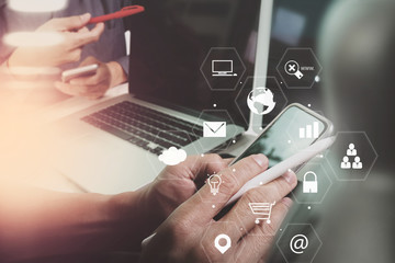 co working team meeting concept,businessman using smart phone and laptop and digital tablet computer in modern office with virtual interface icons network diagram