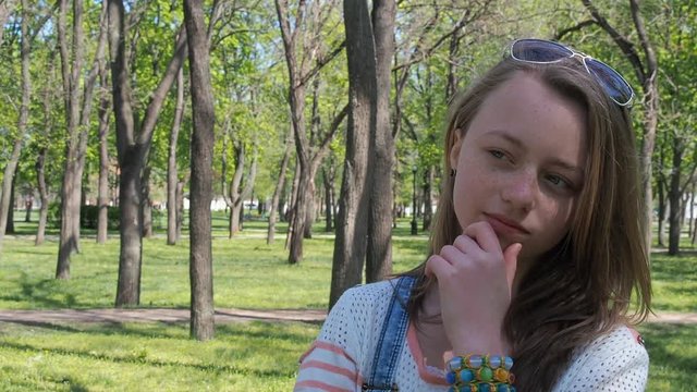 Emotions of a teenage girl. Frightened girl with freckles. Fear of the girl.