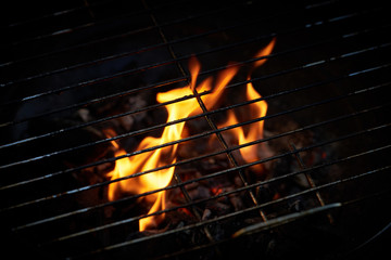 Flame of fire under barbecue grate