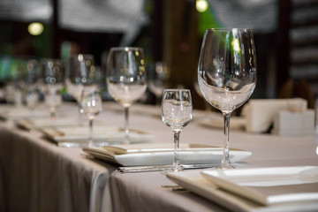 catering table set service with silverware, napkin and glass at restaurant before party