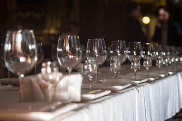 catering table set service with silverware, napkin and glass at restaurant before party