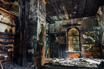 Interior of old mansion after fire. All wooden parts are burnt 