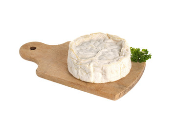Camembert cheese on a wooden board