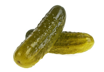 Two marinated pickled cucumbers isolated on white background